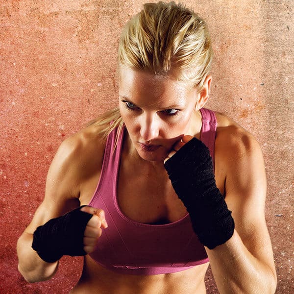 Mixed Martial Arts Lessons for Adults in Mobile AL - Lady Kickboxing Focused Background