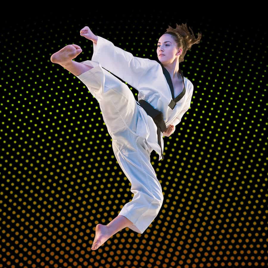 Martial Arts Lessons for Adults in Mobile AL - Girl Black Belt Jumping High Kick